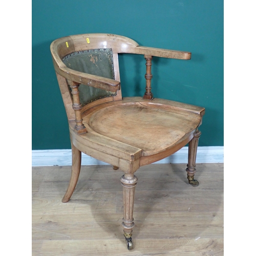 305 - A 19th Century walnut Armchair mounted on reeded tapering front supports with brass casters