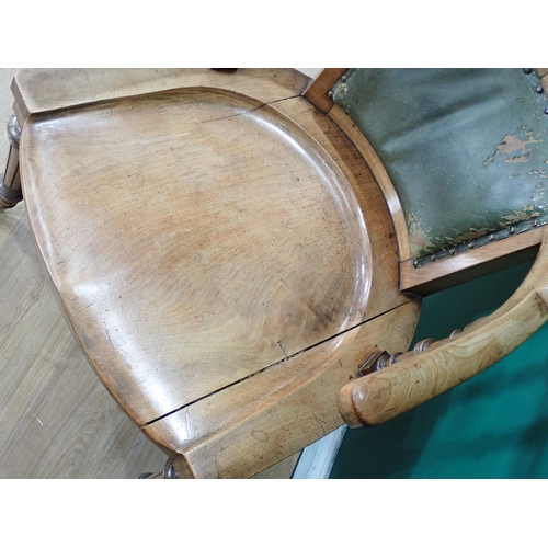 305 - A 19th Century walnut Armchair mounted on reeded tapering front supports with brass casters