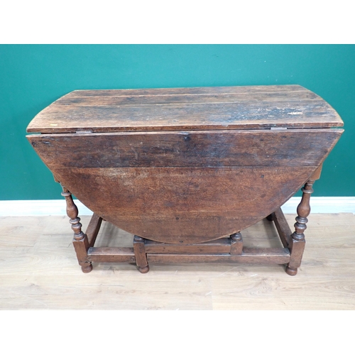 307 - An 18th Century oak Gateleg Table fitted end drawer mounted upon baluster turned supports 3ft 10in W... 