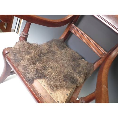 312 - A 19th Century mahogany child's bar-back Elbow Chair needing reupholstery