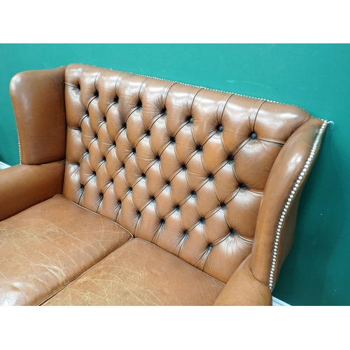 323 - A Georgian style brown leather button back wingback Sofa on square cut supports 4ft W x 3ft 2in H