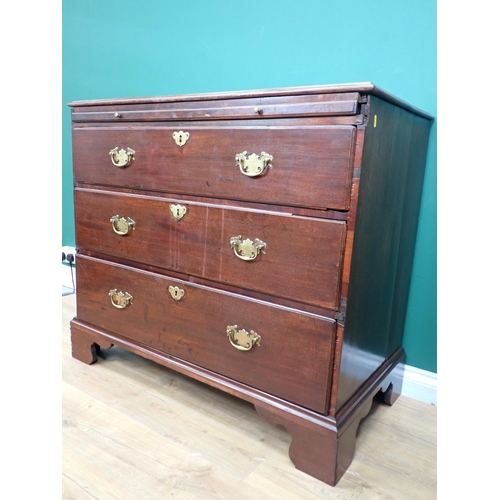 353 - A Georgian mahogany Chest with moulded top fitted three graduated drawers and bachelor's slide mount... 