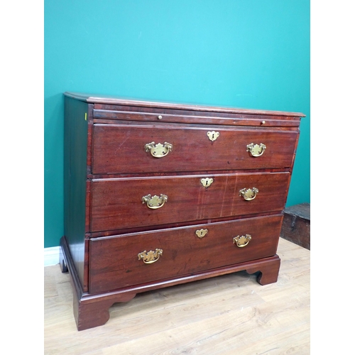 353 - A Georgian mahogany Chest with moulded top fitted three graduated drawers and bachelor's slide mount... 