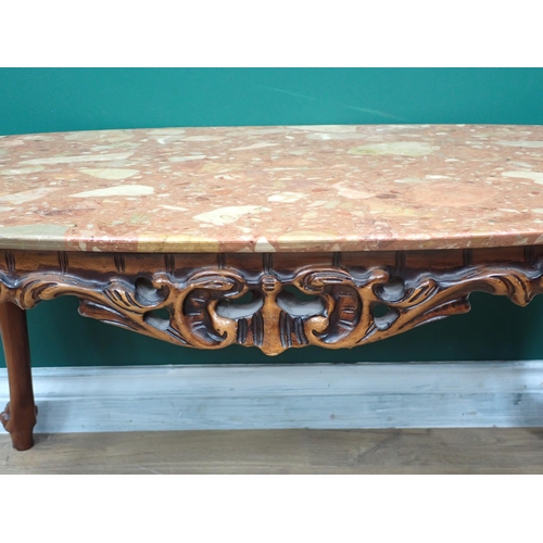 368 - A red polished stone topped oval Coffee Table on base with cabriole supports 3ft 2in W x 1ft 6in H