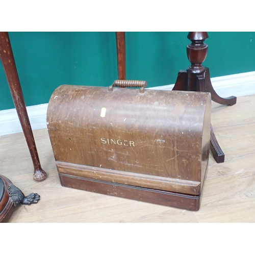 369 - A Singer Sewing Machine, mahogany demi-lune Table, Mirror, Stick Stand and mahogany Torchiere Stand