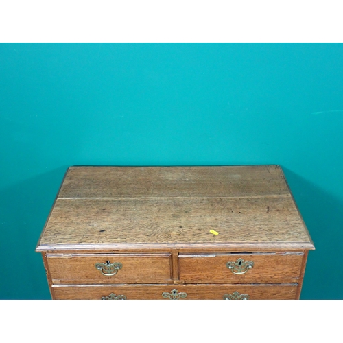 384 - A George III oak Chest of two short and three long graduated drawers mounted on ogee bracket feet 2f... 