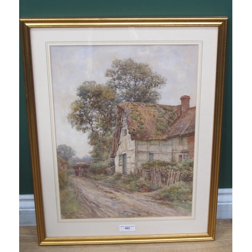 402 - FRANK BESWICK. Horses and wagon on a track, passing a farmhouse, signed, watercolour, 20 x 14½in, to... 