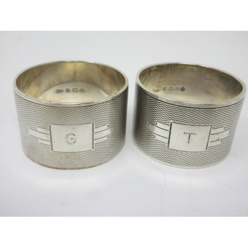 43 - A pair of George V silver heavy Napkin Rings, engraved G & T, Birmingham 1934, and four various silv... 