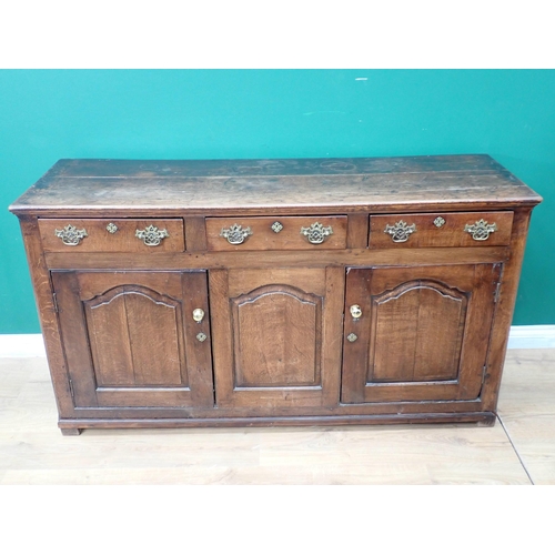 546 - An 18th Century oak Dresser Base fitted three frieze drawers above three fielded cupboard doors 5ft ... 