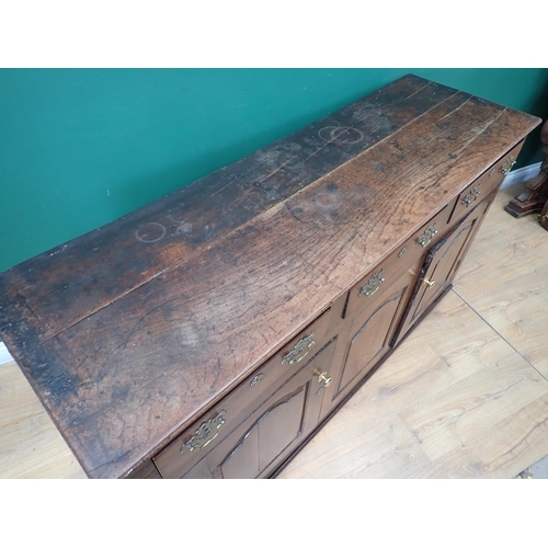 546 - An 18th Century oak Dresser Base fitted three frieze drawers above three fielded cupboard doors 5ft ... 