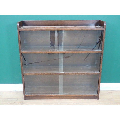 553 - An oak Bookcase with sliding glass doors