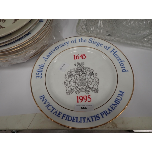 556 - Twelve Sige of Hereford Plates and a glass Dressing Table Set