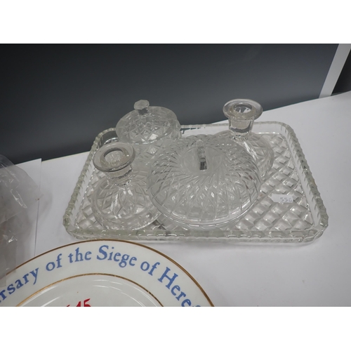 556 - Twelve Sige of Hereford Plates and a glass Dressing Table Set