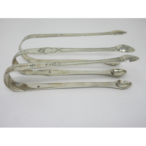 56 - Three pairs of Georgian silver bright-cut Sugar Tongs, one pair by Bateman