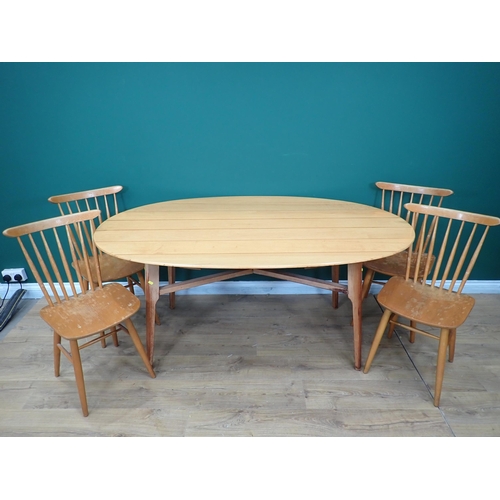 562 - A Gordon Russell oval Dining Table 5ft 4in L x 2ft 5in H and four Ercol style back Chairs