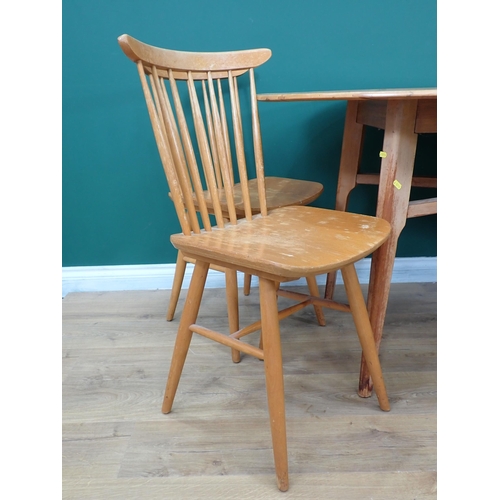 562 - A Gordon Russell oval Dining Table 5ft 4in L x 2ft 5in H and four Ercol style back Chairs