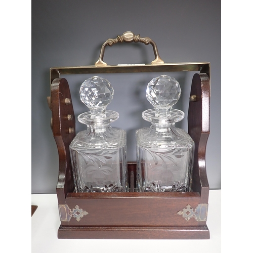 599 - A Tantalus with two decanters, an oak Tantalus without decanters and an incomplete Tantalus