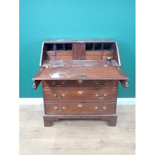 627 - A Georgian oak Bureau fitted four long graduated drawers mounted on ogee bracket feet 3ft 2in H x 2f... 