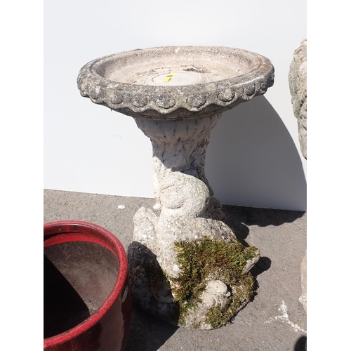 673 - A reconstituted garden Bird Bath, a garden Stand, a figure of a Goose and three Planters