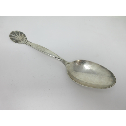 68 - A Georg Jensen silver Serving Spoon with scallop finial, import mark: London 1926