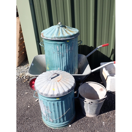 680 - A Wheelbarrow, two metal Dustbins and two galvanised Buckets