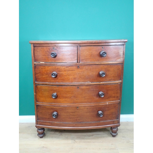 687 - A Victorian mahogany bowfront Chest of two short  and three long drawers on turned supports, 3ft 5in... 