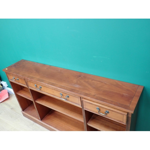 700 - A reproduction yew  wood veneered three bay open Bookcase fitted three drawers 5ft W x 2ft 8in H