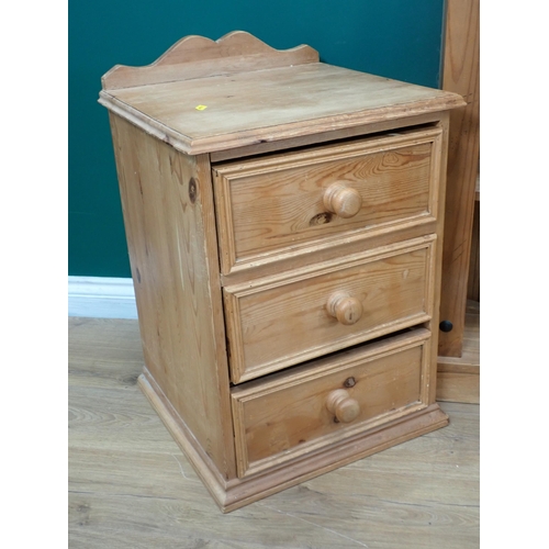 711 - An Ercol elm Wall Shelf, a pine Bookcase and pair of Bedside Chests