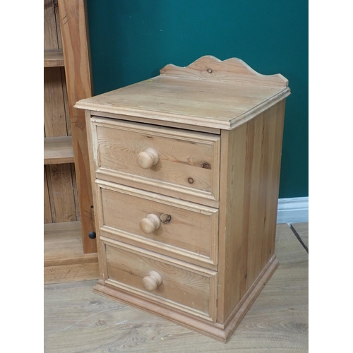 711 - An Ercol elm Wall Shelf, a pine Bookcase and pair of Bedside Chests