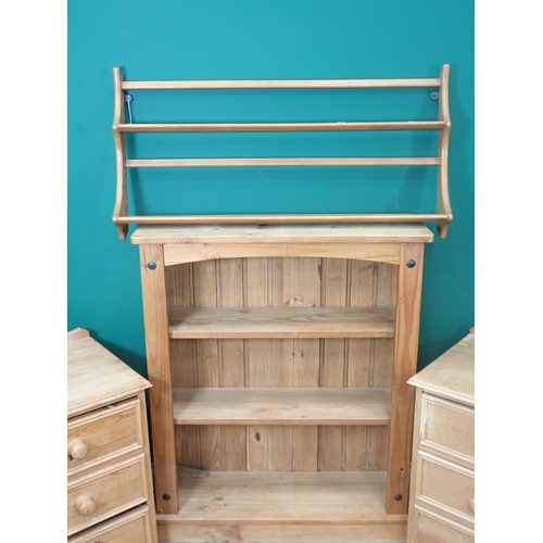 711 - An Ercol elm Wall Shelf, a pine Bookcase and pair of Bedside Chests