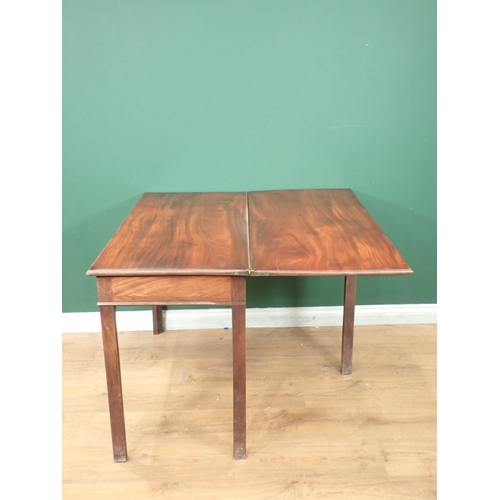 718 - A 19th Century mahogany fold over Tea Table on chamfered supports 3ft 4in W x 2ft 5in H