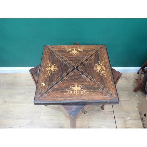 734 - A Victorian rosewood and inlaid Envelope Card Table fitted frieze drawer mounted upon square cut tap... 