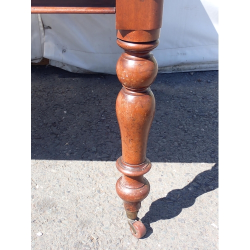 739 - A 19th Century mahogany Library Table with leather inset top mounted on turned supports 5ft 11in W x... 