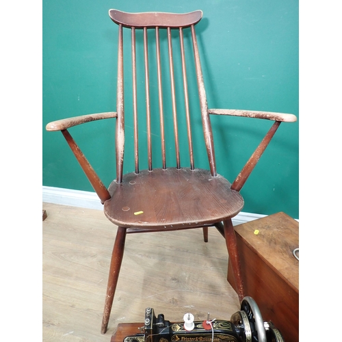 742 - A Sewing Machine, an Ercol Elbow Chair, a Piano Stool and a white painted Blanket Chest