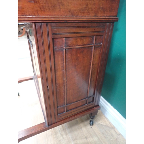 752 - A late Victorian Davenport Desk, fitted cupboard door to the side enclosing drawers and raised on ca... 