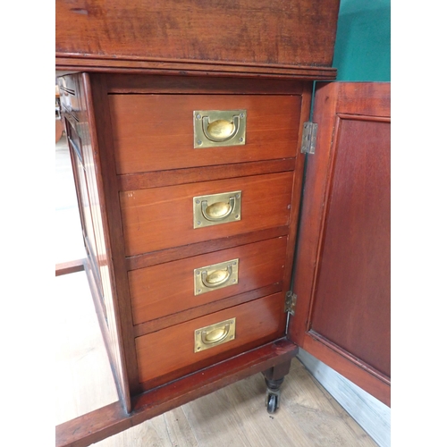 752 - A late Victorian Davenport Desk, fitted cupboard door to the side enclosing drawers and raised on ca... 