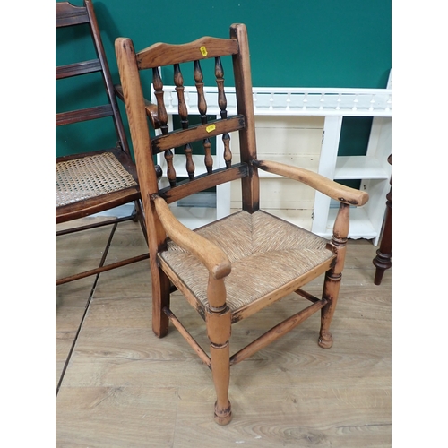 769 - A Victorian mahogany Hall Seat, a child's rush seated Elbow Chair, a cane panelled Folding Chair, a ... 