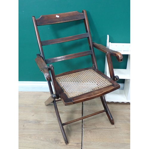 769 - A Victorian mahogany Hall Seat, a child's rush seated Elbow Chair, a cane panelled Folding Chair, a ... 