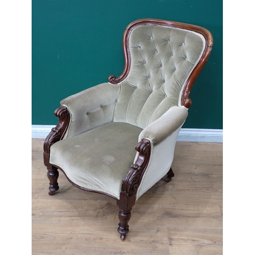 770 - A Victorian button upholstered Armchair on casters