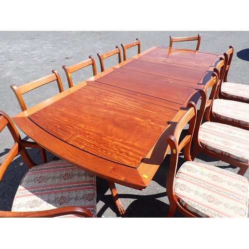 810 - A modern hardwood extending Dining Table with two spare leaves 8ft 4in L x 2ft 6in H and ten Dining ... 