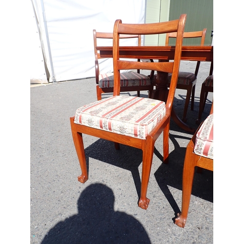 810 - A modern hardwood extending Dining Table with two spare leaves 8ft 4in L x 2ft 6in H and ten Dining ... 