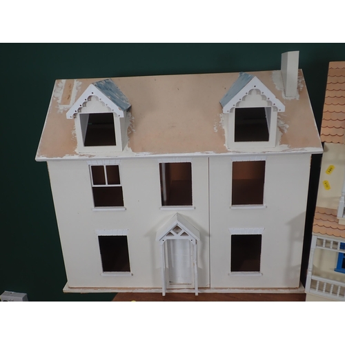 820 - A cream Doll's House with blue windows and an unfinished Doll's House