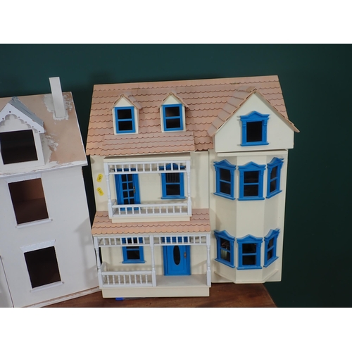 820 - A cream Doll's House with blue windows and an unfinished Doll's House