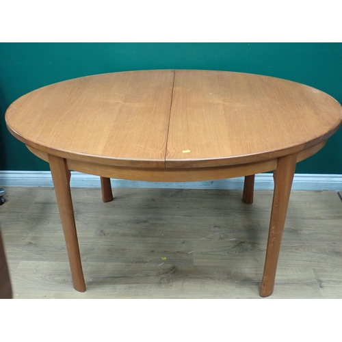 750 - A modern oval extending Dining Table