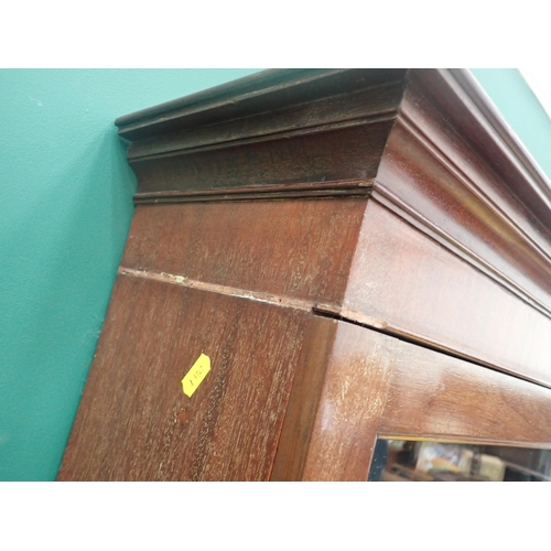 776 - A mahogany Cabinet on stand, with glazed upper door enclosing shelves, above three drawers and a low... 