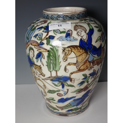 11 - A Persian pottery baluster Vase painted figures hunting on horseback, 10in