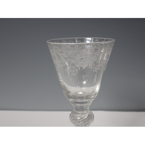 221 - An 18th Century Wine Glass with etched bowl and double knopped air twist stem 6 1/2in H