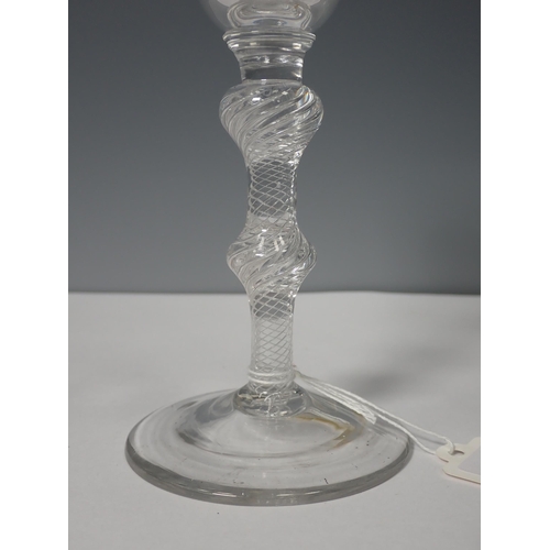 221 - An 18th Century Wine Glass with etched bowl and double knopped air twist stem 6 1/2in H