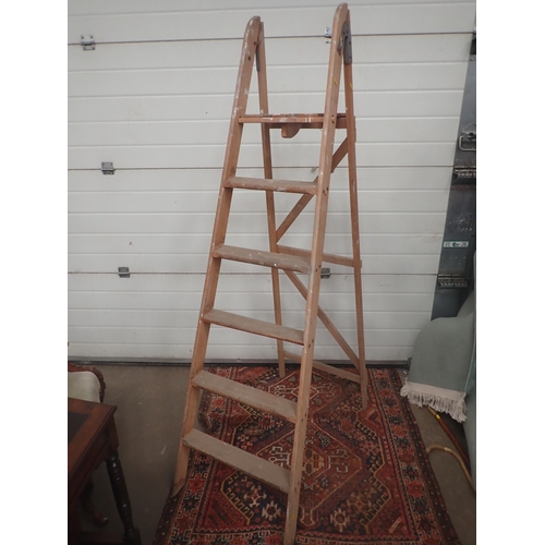 581 - A pair of wooden Step Ladders