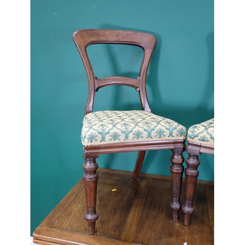 694 - An oak drawleaf Dining Table and two Dining Chairs